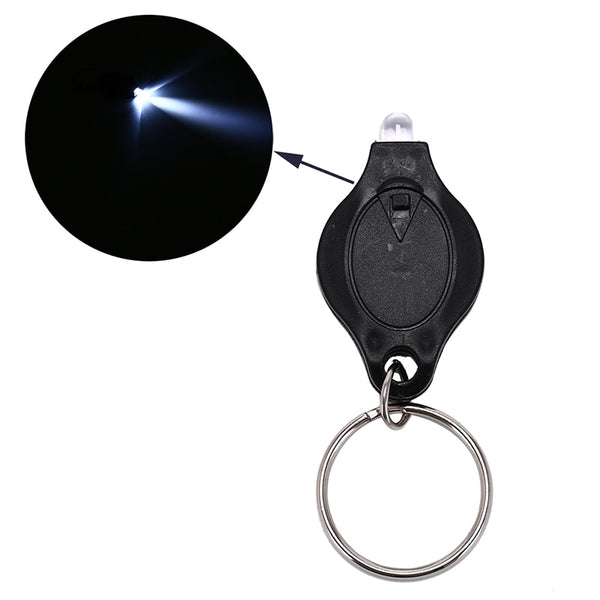 Mini lampe LED porte clé avec pile bouton. Photon Micro-Light de poche