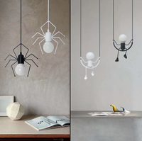 Luminaire bonhomme design LED, balançoire ou araignée, plafonnier original et moderne en métal