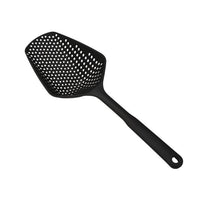 Louche égouttoir. Grosse cuillère pour égoutter les pâtes riz etc en se servant