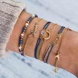 Bracelet multiple, ancre, signe infini, flèche, love, cœur, terre, boussole, coquillage
