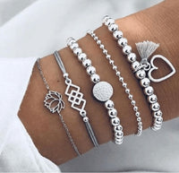 Bracelet multiple, ancre, signe infini, flèche, love, cœur, terre, boussole, coquillage