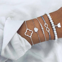 Bracelet multiple, ancre, signe infini, flèche, love, cœur, terre, boussole, coquillage
