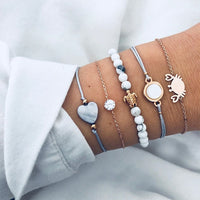 Bracelet multiple, ancre, signe infini, flèche, love, cœur, terre, boussole, coquillage