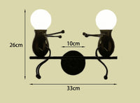 Luminaire design balançoire LED, applique murale originale et moderne, bonhomme minimaliste