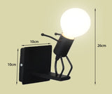 Luminaire design balançoire LED, applique murale originale et moderne, bonhomme minimaliste