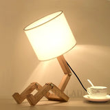 Lampe bonhomme articulé en bois, luminaire design original