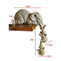 Statue d'éléphants en résine avec bébés. Serre livres ou décoration
