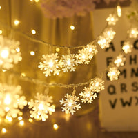 Guirlande lumineuse avec flocons de neige ou points lumineux