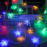 Guirlande lumineuse avec flocons de neige ou points lumineux