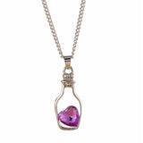 Chaîne avec pendentif cœur dans une bouteille