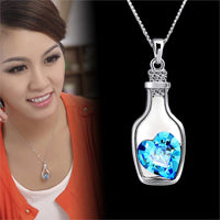 Chaîne avec pendentif cœur dans une bouteille