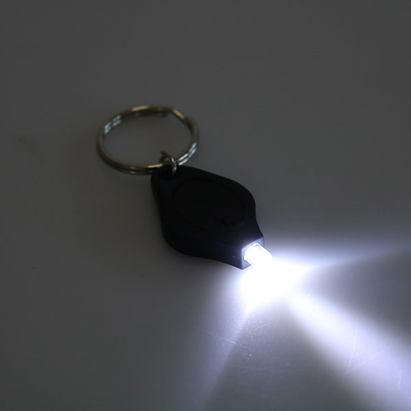 Mini lampe LED porte clé avec pile bouton. Photon Micro-Light de